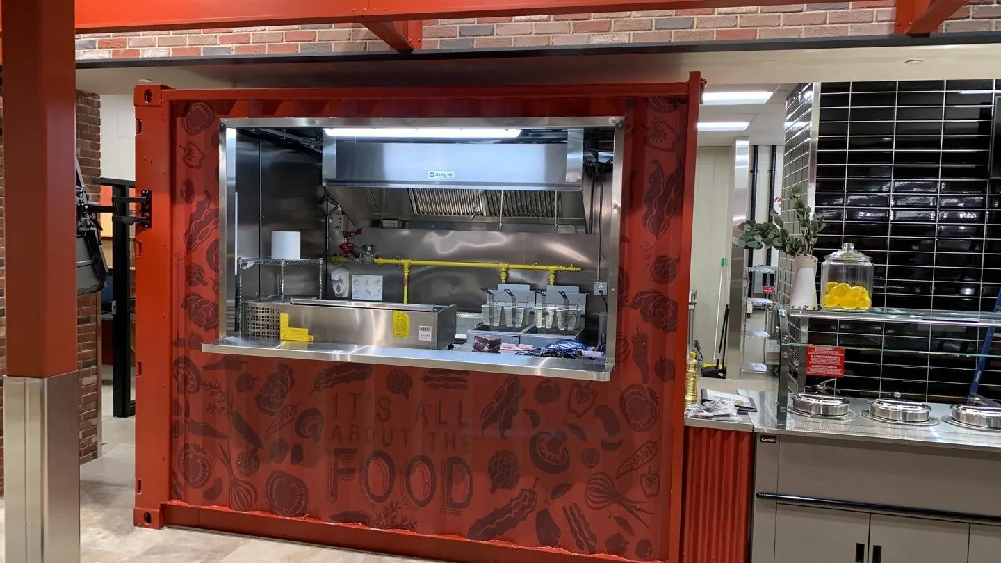 A food cart with the words " food " written on it.